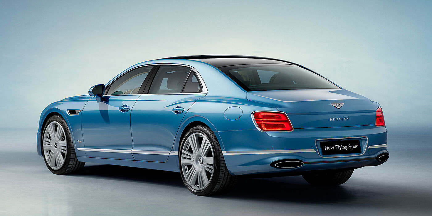 Bentley Gold Coast (Australia) New Bentley Flying Spur Azure sedan rear view in Light windsor blue by Mulliner paint with 22 inch Azure wheels and chrome exterior details