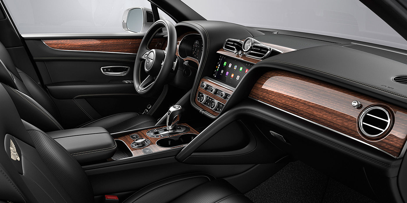 Bentley Gold Coast (Australia) Bentley Bentayga interior with a Crown Cut Walnut veneer, view from the passenger seat over looking the driver's seat.