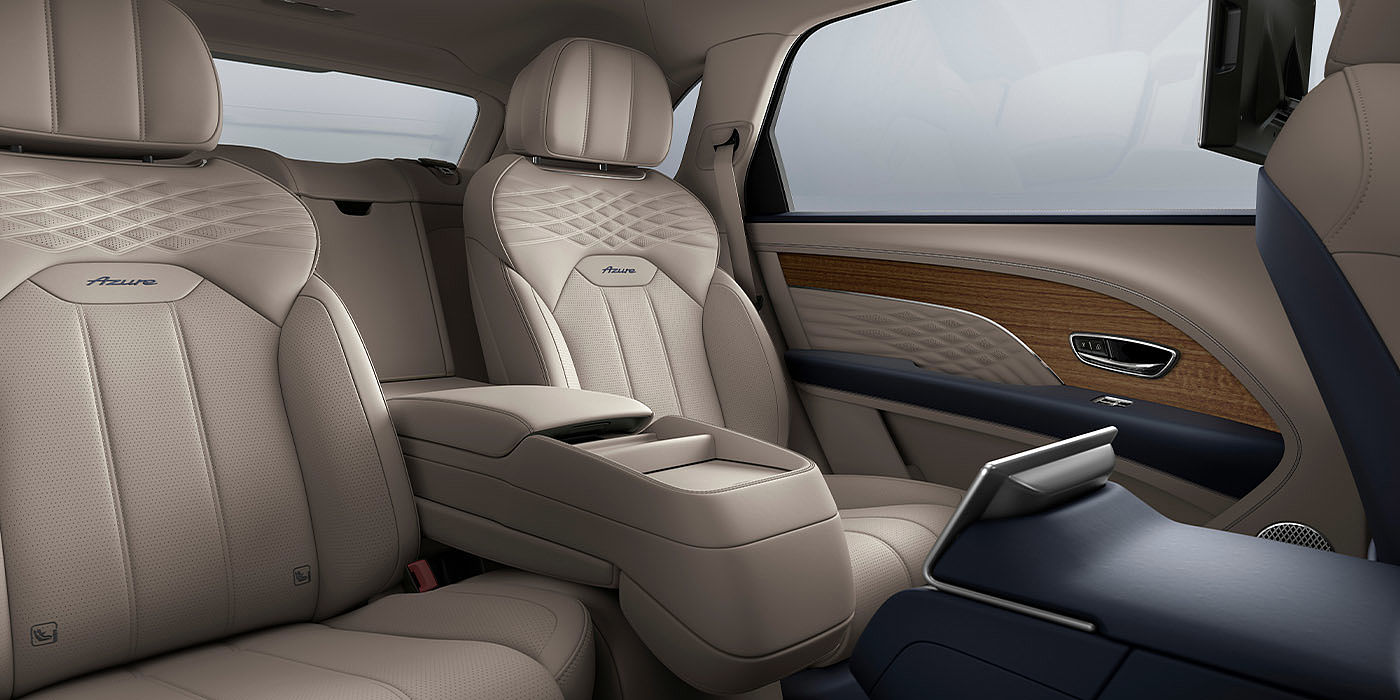 Bentley Gold Coast (Australia) Bentley Bentayga EWB Azure interior view for rear passengers with Portland hide featuring Azure Emblem in Imperial Blue contrast stitch.