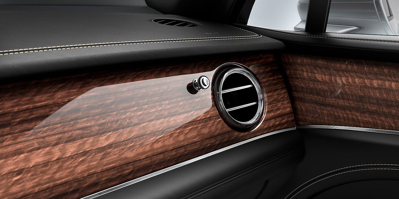 Bentley Gold Coast (Australia) Bentley Bentayga front interior Crown Cut Walnut veneer and chrome air vent.