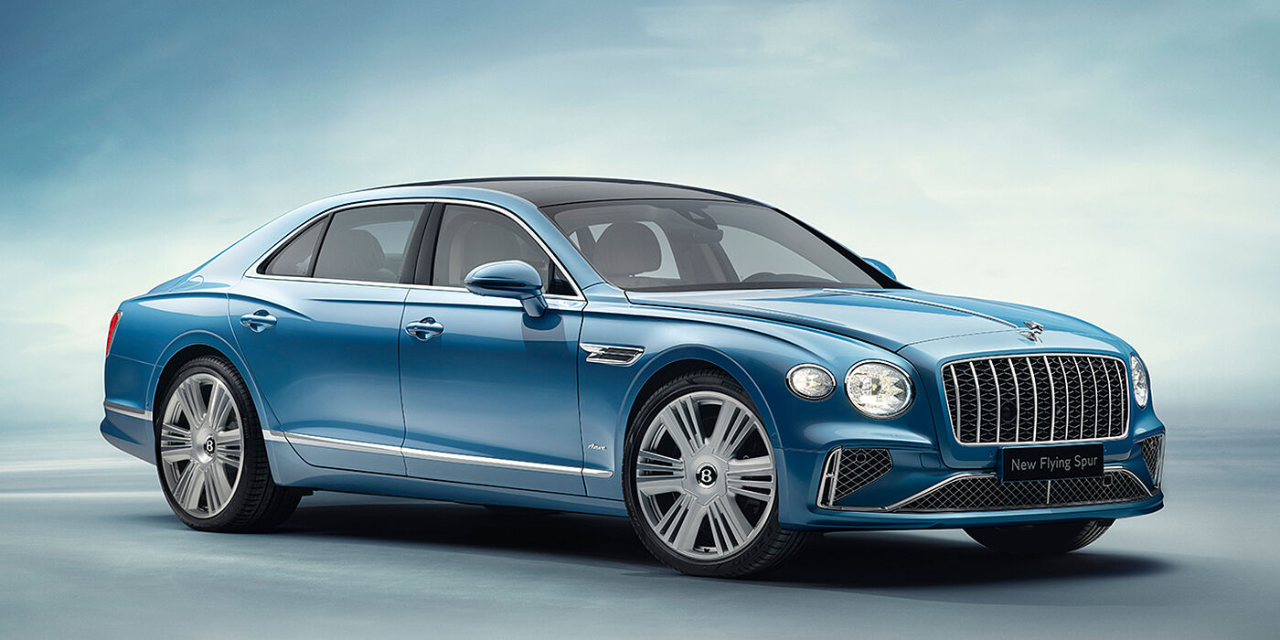 Bentley Gold Coast (Australia) New Bentley Flying Spur Azure sedan front view in Light windsor blue by Mulliner paint with 22 inch Azure wheels and chrome exterior details
