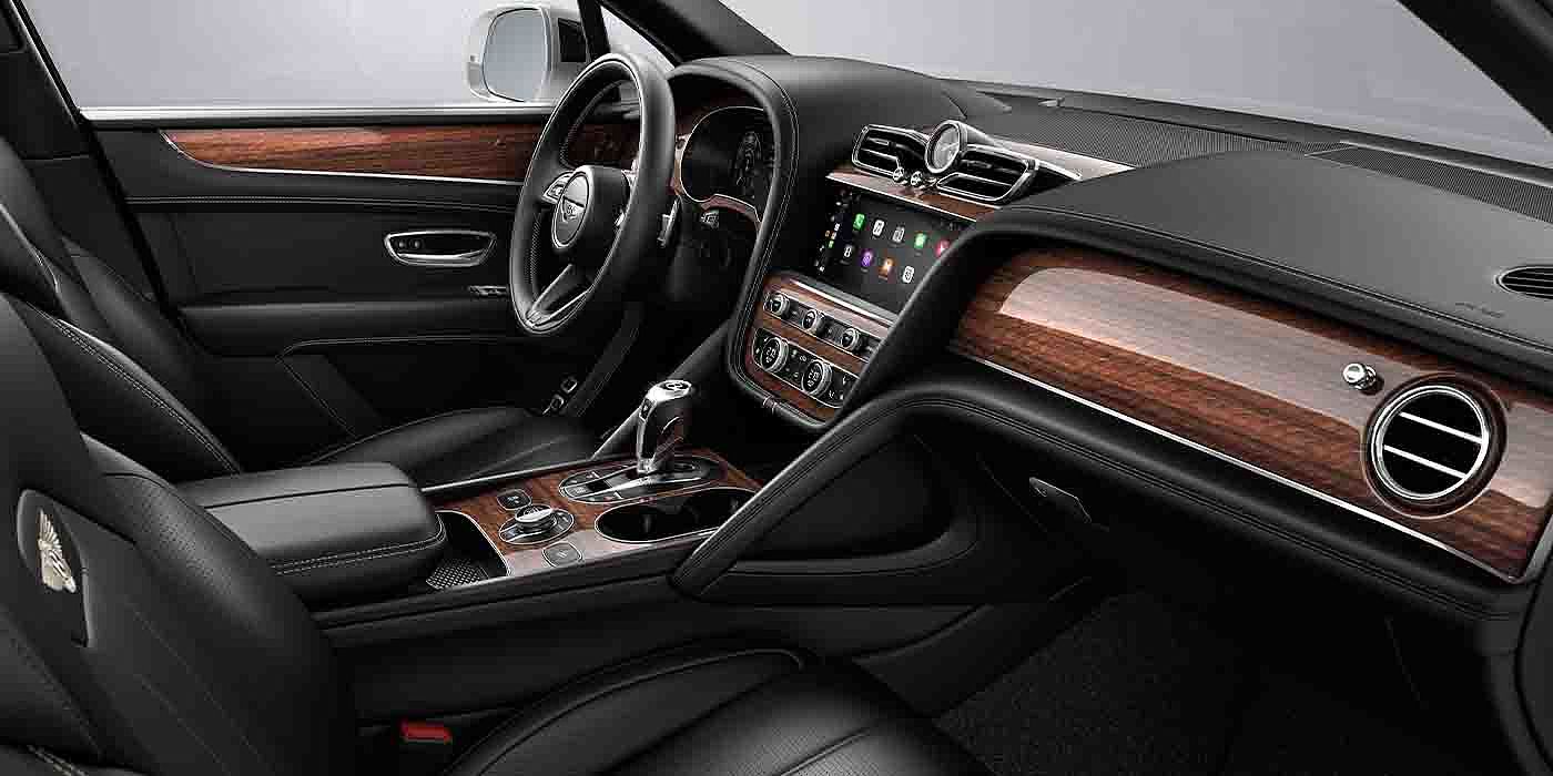 Bentley Gold Coast (Australia) Bentley Bentayga EWB interior with a Crown Cut Walnut veneer, view from the passenger seat over looking the driver's seat.