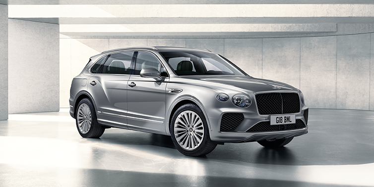 Bentley Gold Coast (Australia) Bentley Bentayga Extended Wheelbase SUV front three quarter in Moonbeam paint with a grey background