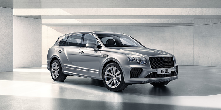 Bentley Gold Coast (Australia) Bentley Bentayga Extended Wheelbase SUV front three quarter in Moonbeam paint with a grey background