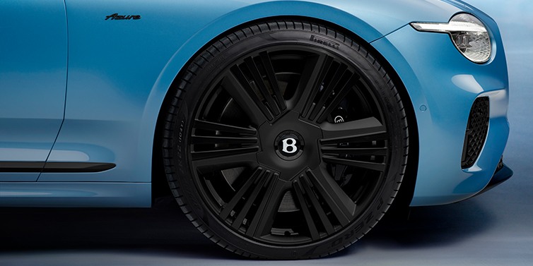Bentley Gold Coast (Australia) New Bentley Continental GTC Azure convertible front wheel detail with 22 inch black ten spoke wheel and dark chrome details against Light Windsor blue paint