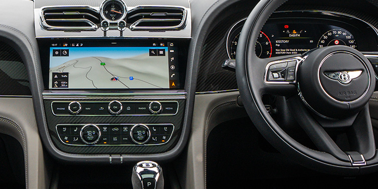 Bentley Gold Coast (Australia) Bentley Bentayga S SUV front interior with right hand drive steering wheel and centre console with MMI screen showing driving directions