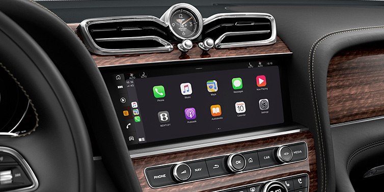 Bentley Gold Coast (Australia) Bentley Bentayga Extended Wheelbase SUV front interior centre console MMI screen showing apps surrounded by Beluga black hide and Crown Cut Walnut veneer